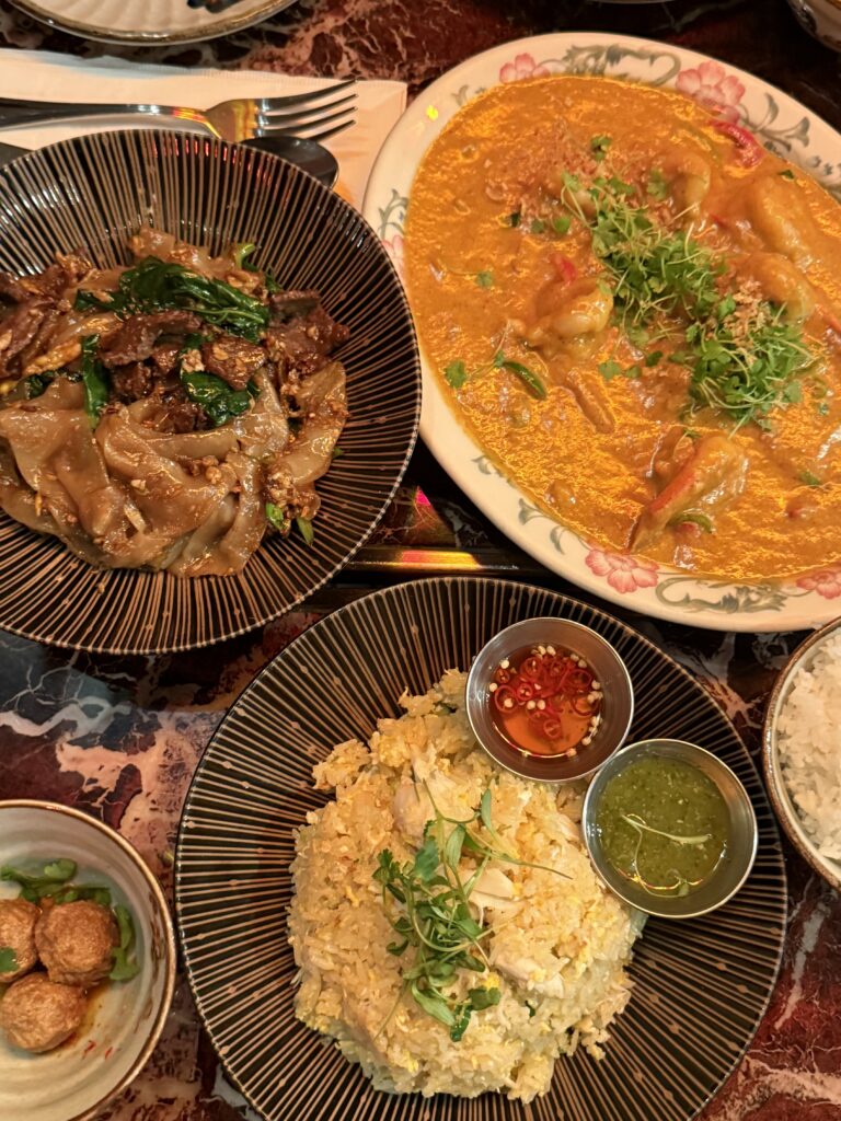 3 trays of various thai foods