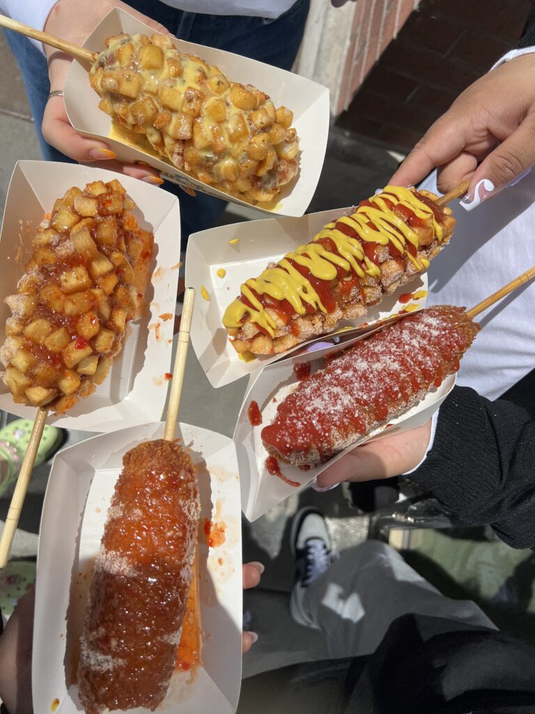 5 korean hot dogs with various toppings