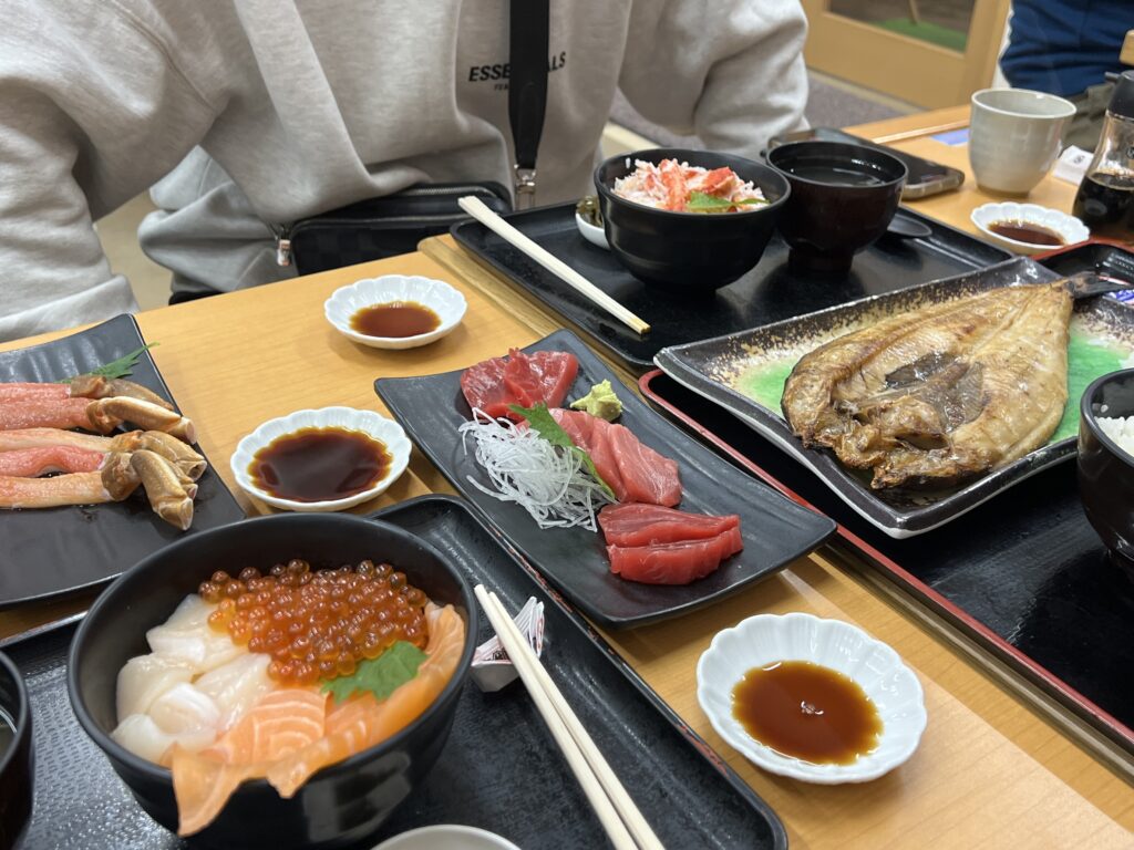 grilled fish, sashimi, and assorted seafood rice bowl