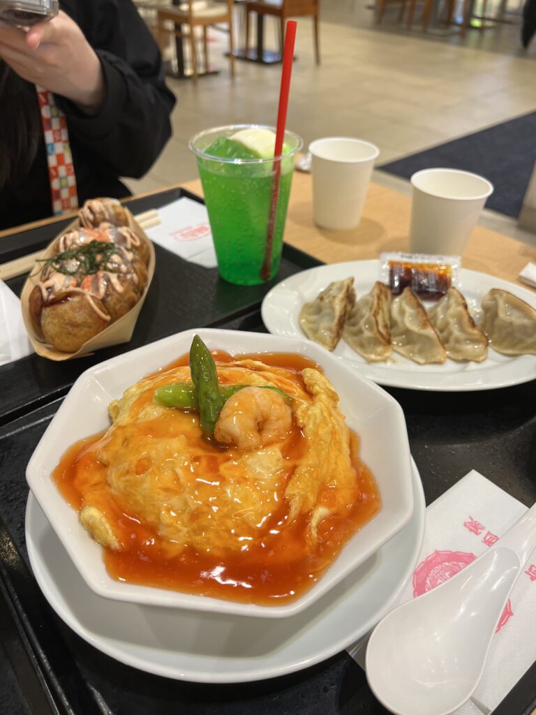 omurice in bowl, dumplings, takoyaki, and melon soda