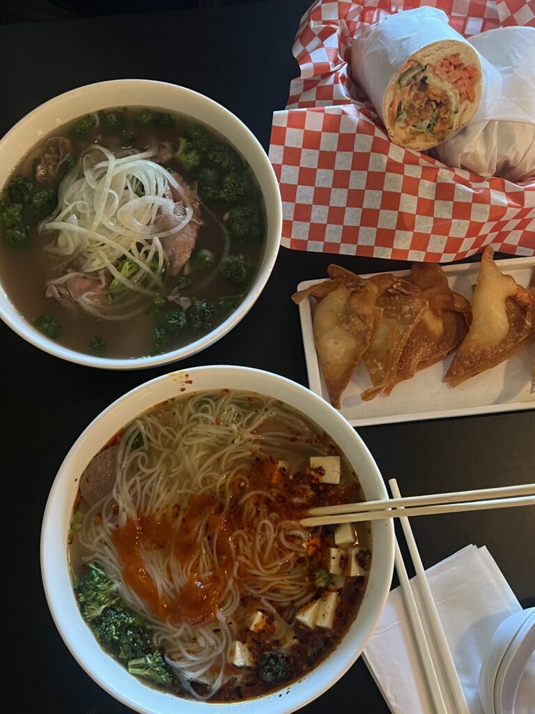 2 bowls of pho, banh mi, and shrimp wontons