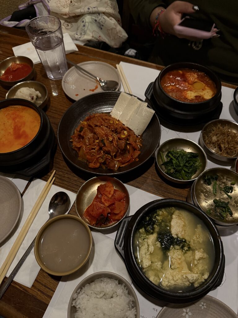 spread of various korean soups and dishes
