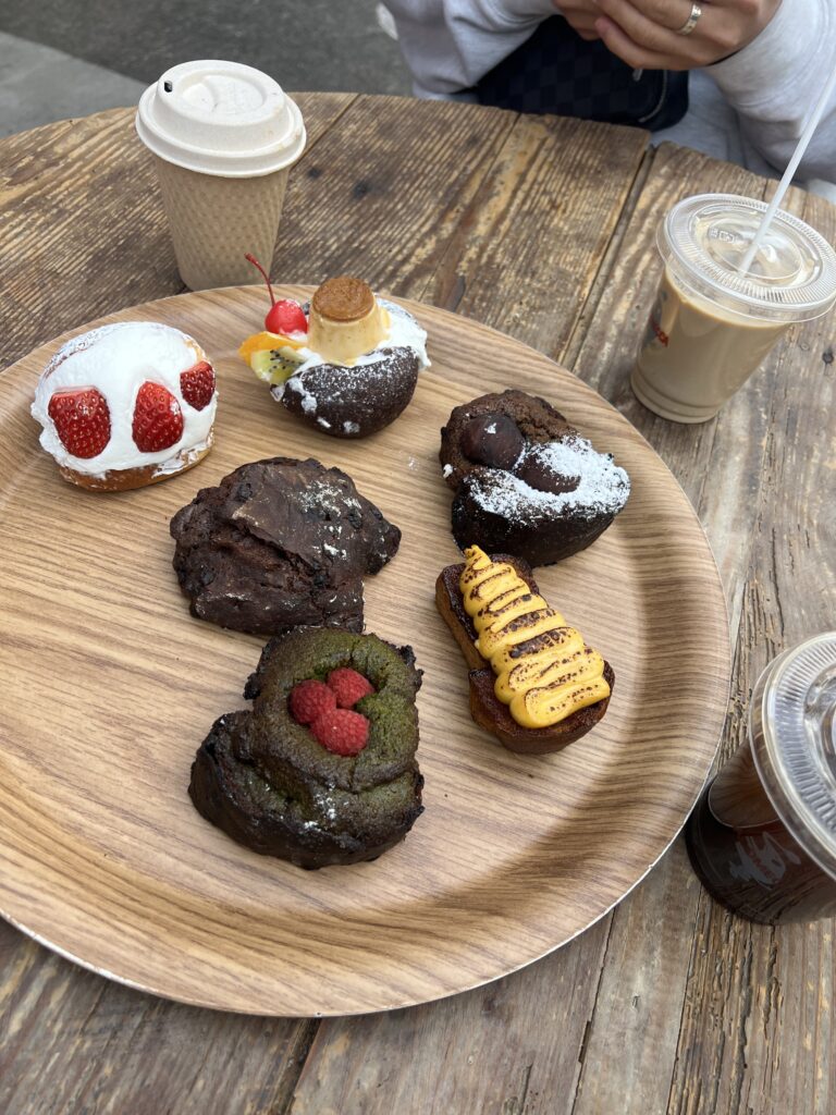 wooden tray filled with pastries and desserts