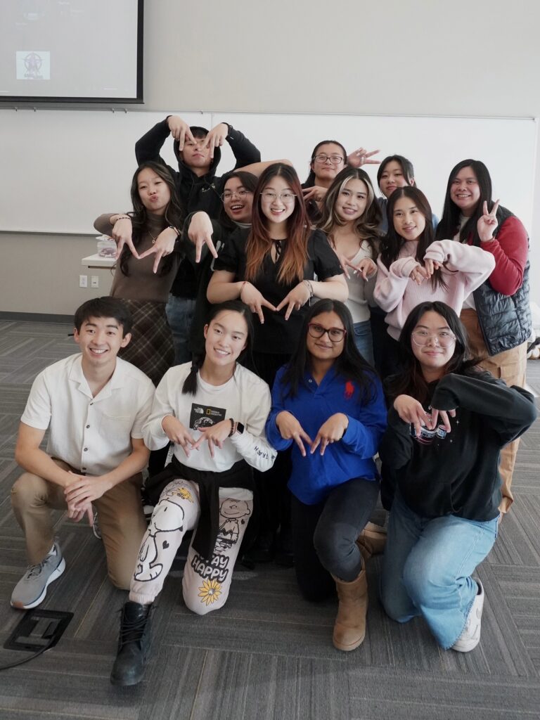 group photo of author with her club officers