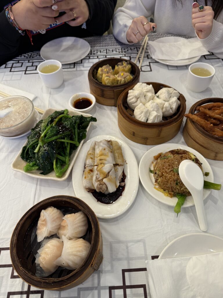 plates of dim sum and other chinese dishes on table