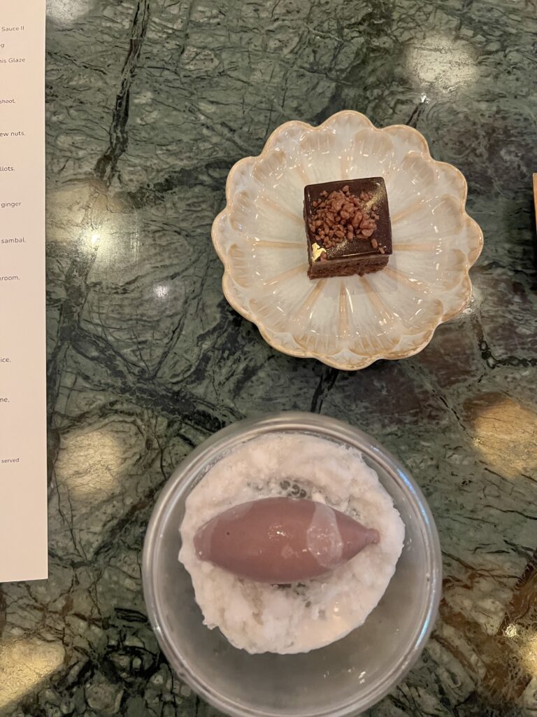 Decorated desserts on plates on table