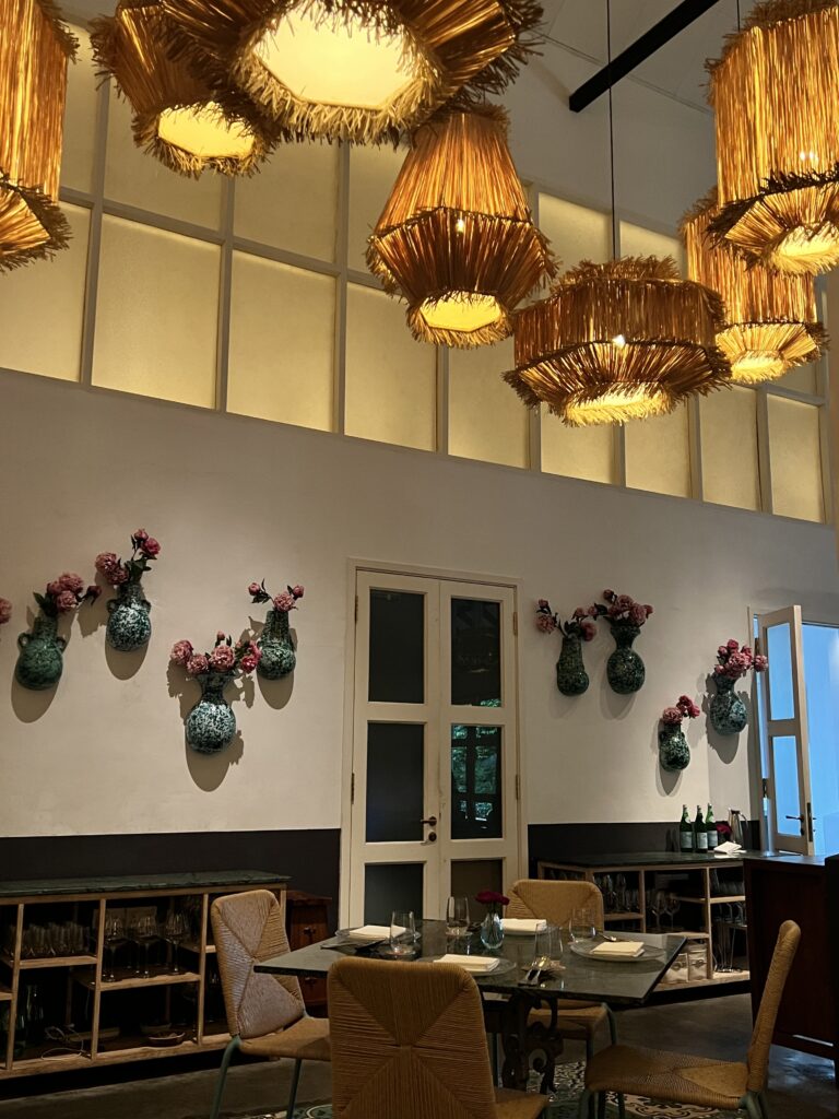 Interior of Candlenut with big hanging chandeliers
