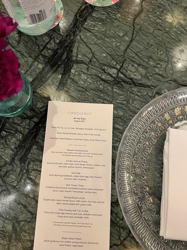 Candlenut menu on green table