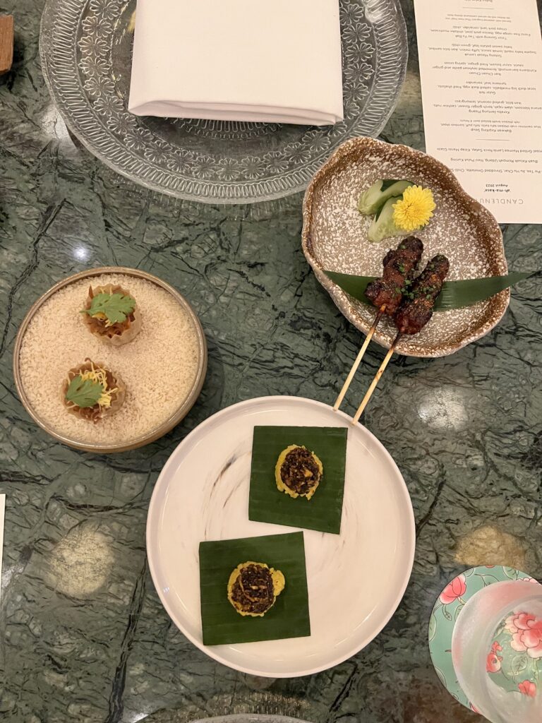 3 Peranakan dishes on plates next to each other
