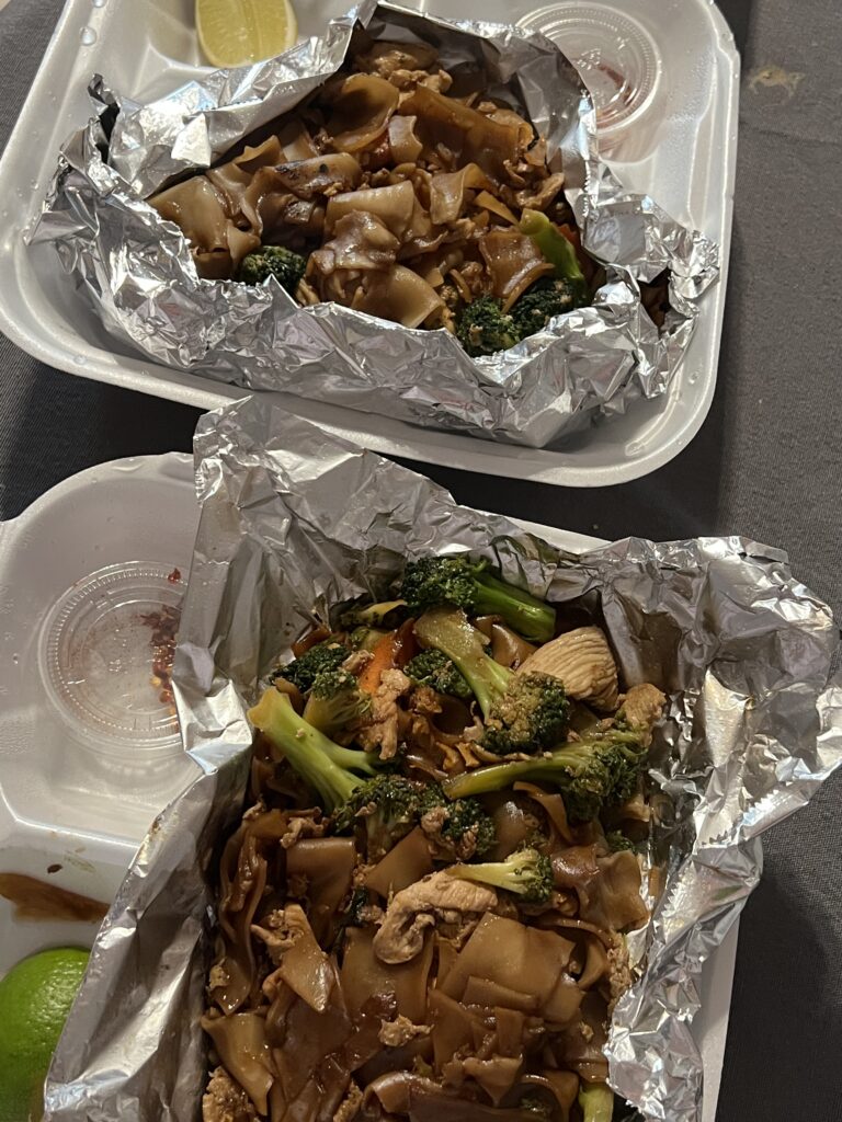 pad thai and pad see ew on table