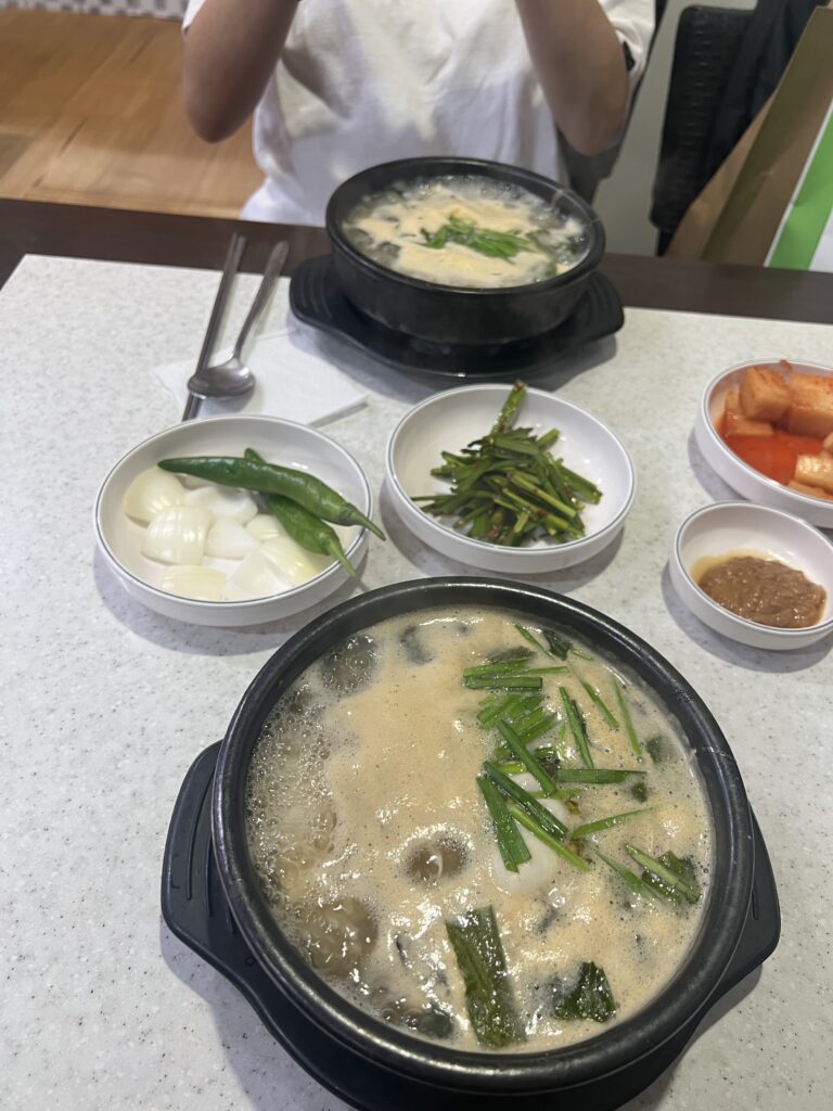2 oyster gukbaps in stone bowls on table