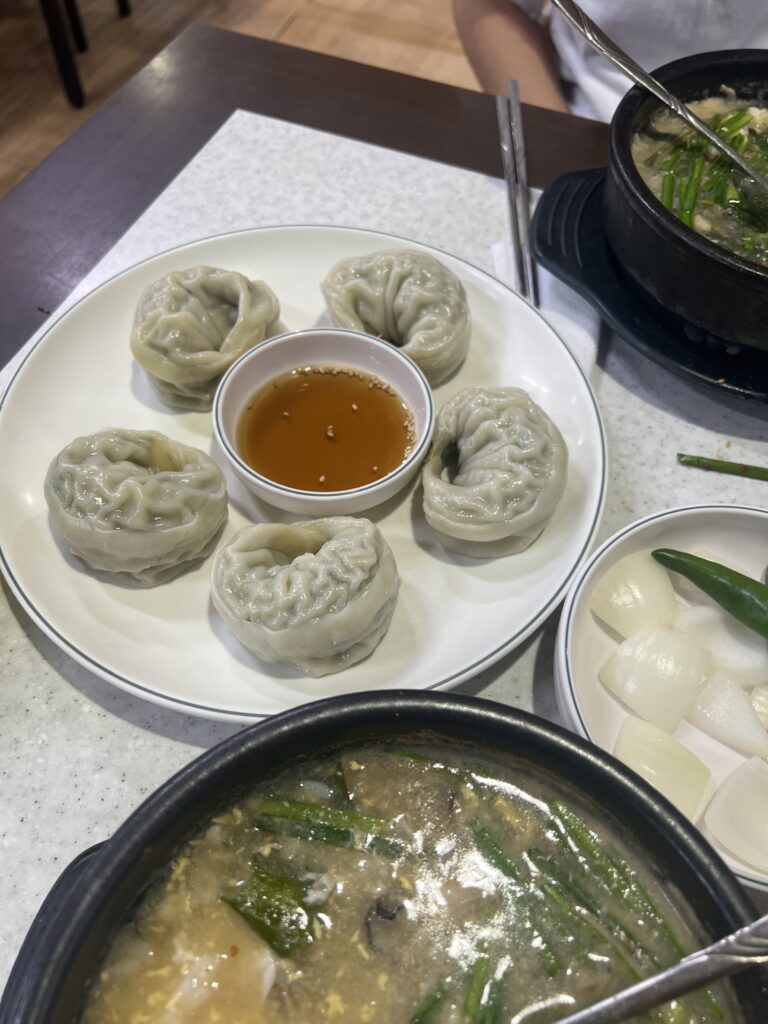 steamed dumplings on plate on table
