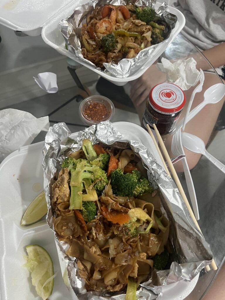 pad thai and pad see ew on table