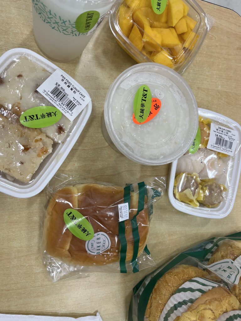 grocery store Chinese food packaged in plastic containers on table