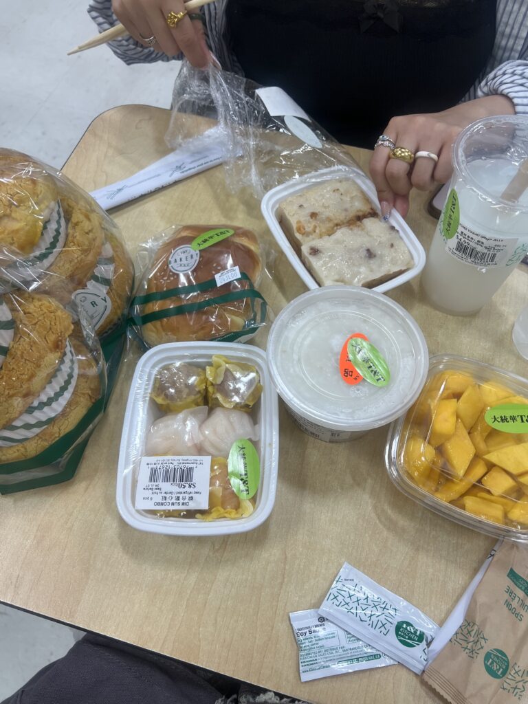 grocery store Chinese food packaged in plastic containers on table